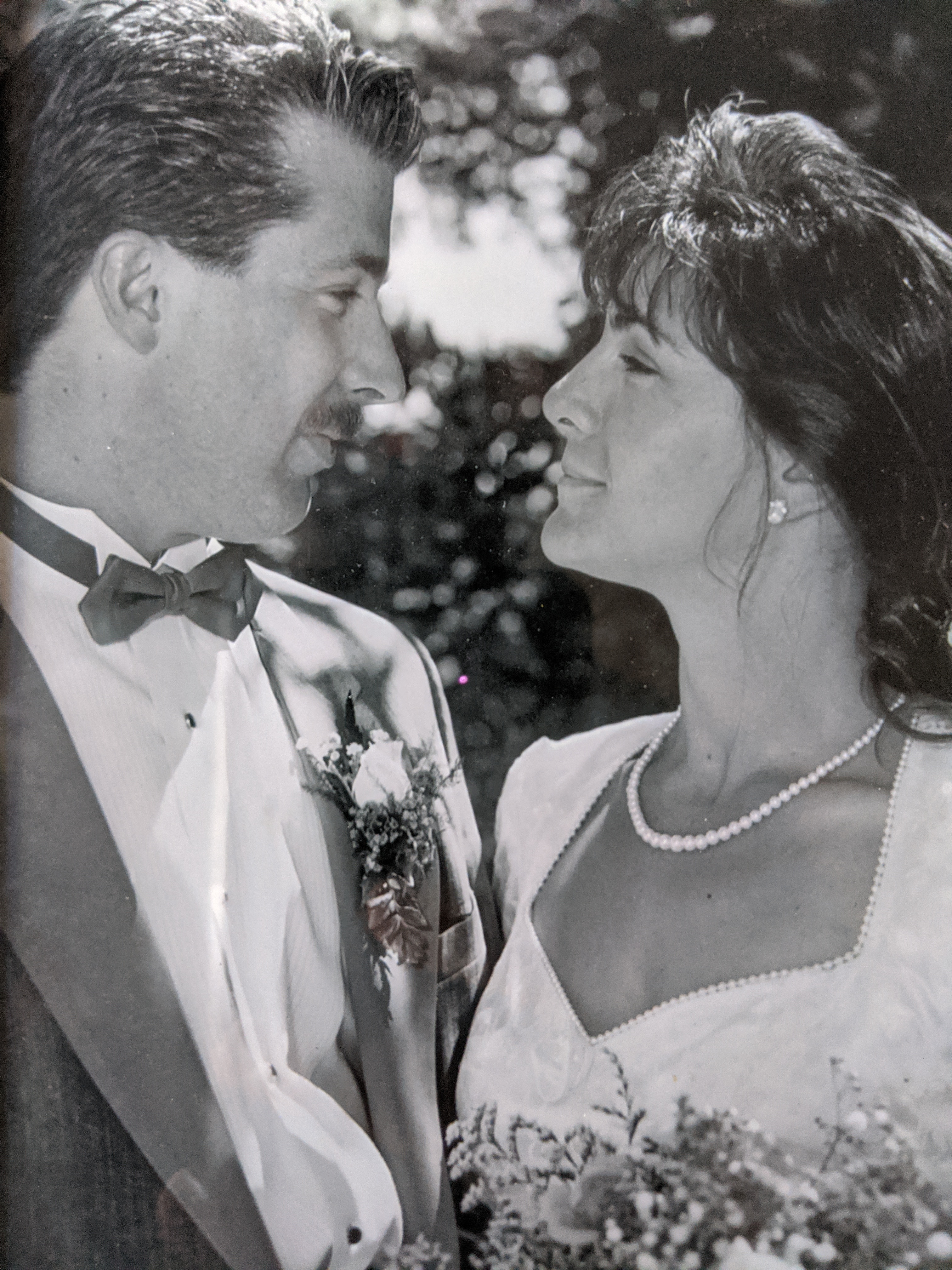 black and white photo of couple at wedding